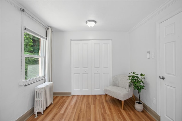 3863 Beechwood Blvd, Greenfield, PA 15217 - sitting room featuring radiator, light wood finished floors, and ornamental molding