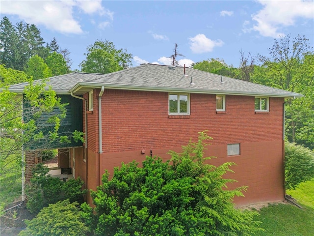 110 Steinbach Ln, Jefferson Hills, PA 15025 - view of side of property with brick siding and roof with shingles