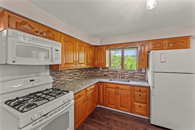 110 Steinbach Ln, Jefferson Hills, PA 15025 - kitchen featuring white appliances, brown cabinetry, dark wood finished floors, and tasteful backsplash