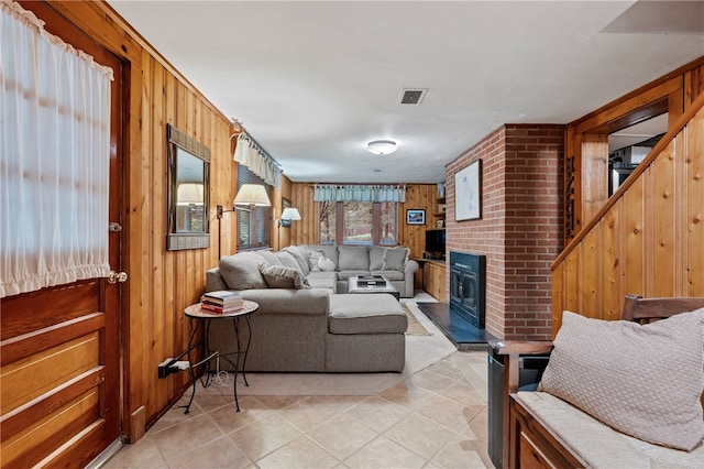2666 Pointview Dr, Hampton, PA 15101 - living area featuring wooden walls, light tile patterned floors, and a fireplace