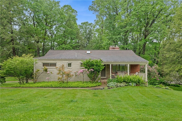 2666 Pointview Dr, Hampton, PA 15101 - view of front of property with covered porch, a front lawn, and a chimney