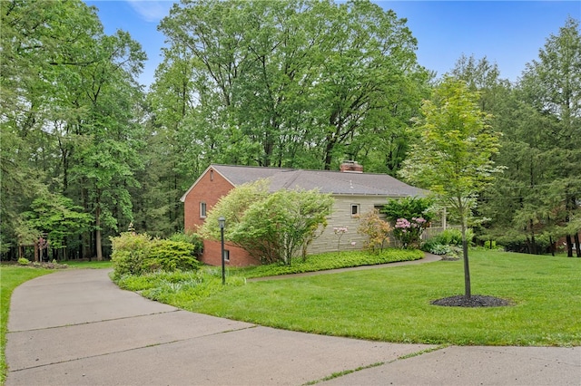 2666 Pointview Dr, Hampton, PA 15101 - view of home's exterior with a chimney, a lawn, and brick siding