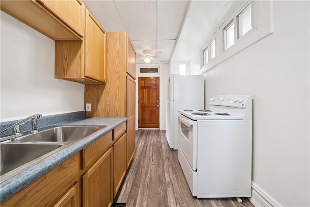 422 N 3rd St, Jeannette, PA 15644 - kitchen featuring white appliances, wood finished floors, and a ceiling fan