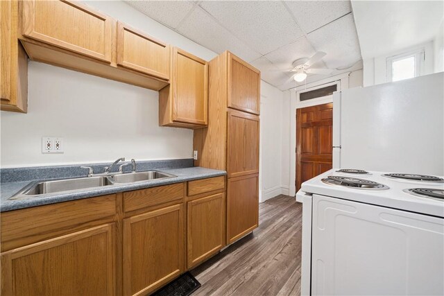 422 N 3rd St, Jeannette, PA 15644 - kitchen featuring white appliances, wood finished floors, a ceiling fan, and a paneled ceiling