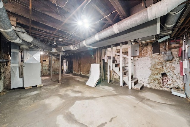 422 N 3rd St, Jeannette, PA 15644 - unfinished below grade area featuring heating unit, stairs, and gas water heater