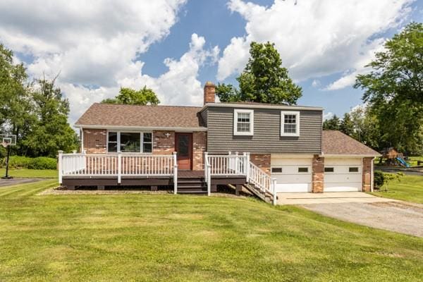 408 Circle Dr, Franklin Twp, PA 16117 - tri-level home with a front lawn, a wooden deck, brick siding, a chimney, and driveway