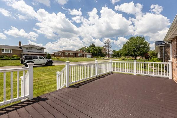 408 Circle Dr, Franklin Twp, PA 16117 - deck with a lawn and a residential view