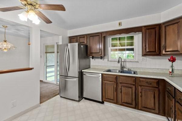 408 Circle Dr, Franklin Twp, PA 16117 - kitchen featuring appliances with stainless steel finishes, light flooring, light countertops, and a ceiling fan