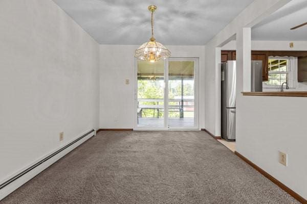 408 Circle Dr, Franklin Twp, PA 16117 - spare room featuring baseboard heating, carpet, and a chandelier