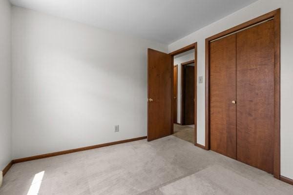 408 Circle Dr, Franklin Twp, PA 16117 - unfurnished bedroom with a closet and light colored carpet