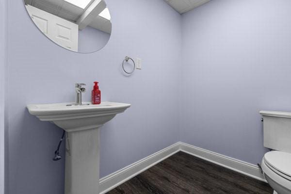 408 Circle Dr, Franklin Twp, PA 16117 - bathroom with toilet and wood finished floors