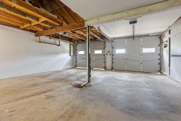 408 Circle Dr, Franklin Twp, PA 16117 - garage featuring a garage door opener
