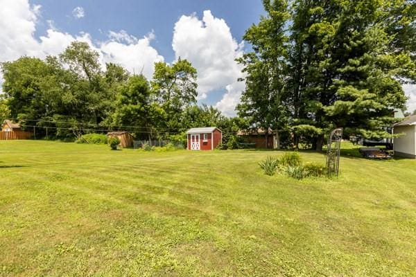 408 Circle Dr, Franklin Twp, PA 16117 - view of grassy yard featuring a storage shed