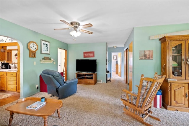 817 E Jamestown Rd, Green Twp, PA 16134 - living room featuring a ceiling fan, arched walkways, and light carpet