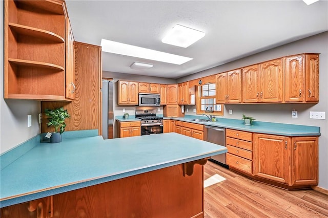 2801 Valley View Rd, South Pymatuning Twp, PA 16150 - kitchen featuring appliances with stainless steel finishes, light wood-type flooring, a peninsula, and light countertops