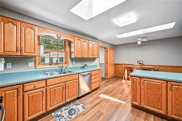 2801 Valley View Rd, South Pymatuning Twp, PA 16150 - kitchen with a skylight, dishwasher, light wood finished floors, brown cabinetry, and ceiling fan