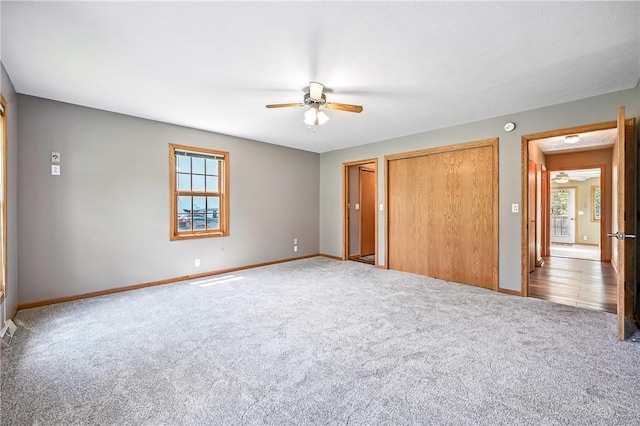2801 Valley View Rd, South Pymatuning Twp, PA 16150 - unfurnished bedroom featuring carpet flooring, multiple windows, two closets, and a ceiling fan