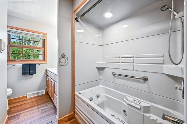 2801 Valley View Rd, South Pymatuning Twp, PA 16150 - bathroom with vanity, wood finished floors, a combined bath / shower with jetted tub, and recessed lighting