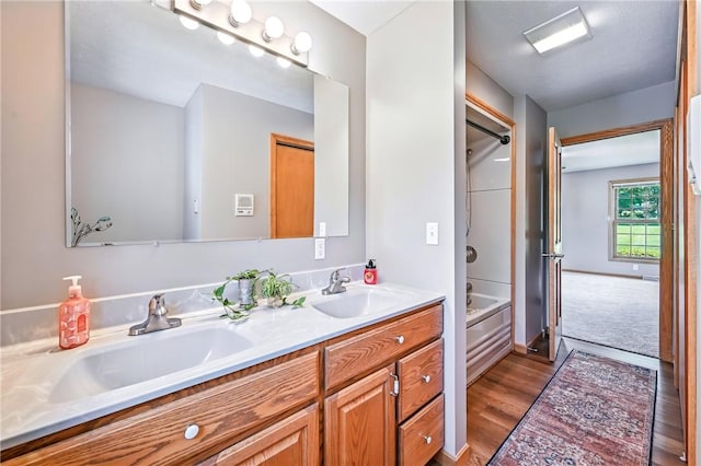 2801 Valley View Rd, South Pymatuning Twp, PA 16150 - bathroom with double vanity, wood finished floors, and bathtub / shower combination
