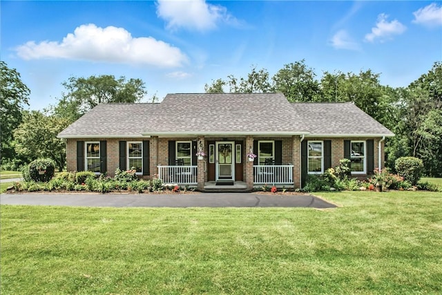 2801 Valley View Rd, South Pymatuning Twp, PA 16150 - view of front of property with brick siding, a front lawn, covered porch, and roof with shingles