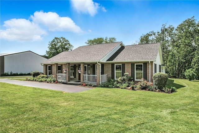 2801 Valley View Rd, South Pymatuning Twp, PA 16150 - view of front of house featuring brick siding, covered porch, a front lawn, and roof with shingles