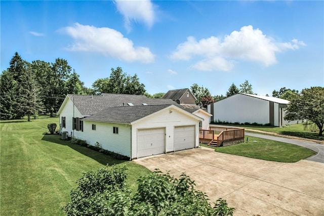 2801 Valley View Rd, South Pymatuning Twp, PA 16150 - view of side of home with a lawn, roof with shingles, a wooden deck, and a garage