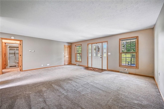 2801 Valley View Rd, South Pymatuning Twp, PA 16150 - carpeted empty room featuring healthy amount of natural light and a textured ceiling
