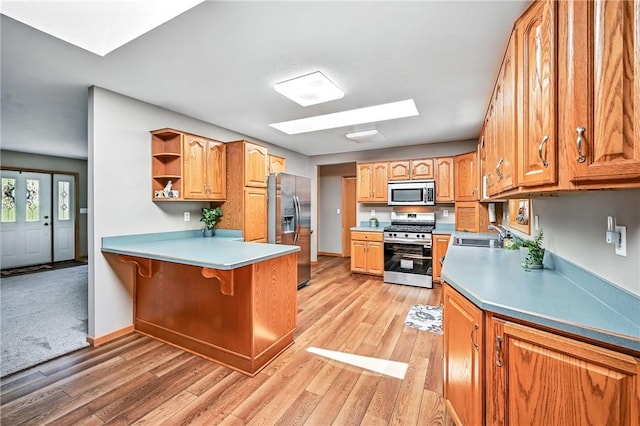2801 Valley View Rd, South Pymatuning Twp, PA 16150 - kitchen featuring stainless steel appliances, a peninsula, light wood-style floors, and open shelves