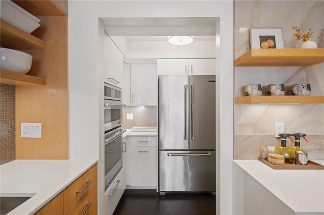 316 Beaver St Unit 301, Sewickley, PA 15143 - kitchen featuring stainless steel appliances, open shelves, tasteful backsplash, and white cabinets