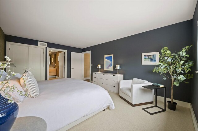 316 Beaver St Unit 301, Sewickley, PA 15143 - carpeted bedroom featuring ensuite bath and baseboards