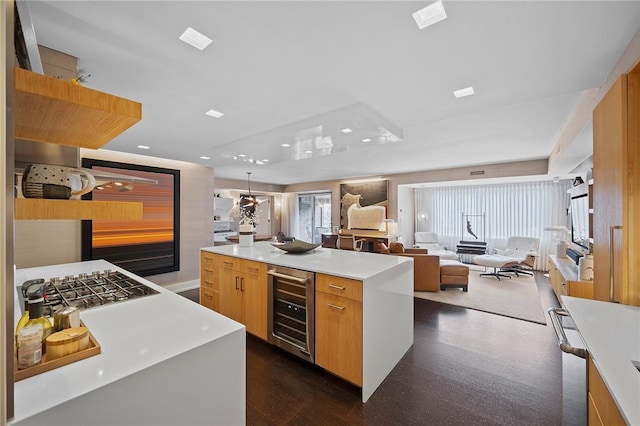 316 Beaver St Unit 301, Sewickley, PA 15143 - kitchen featuring beverage cooler, modern cabinets, light countertops, open floor plan, and a center island