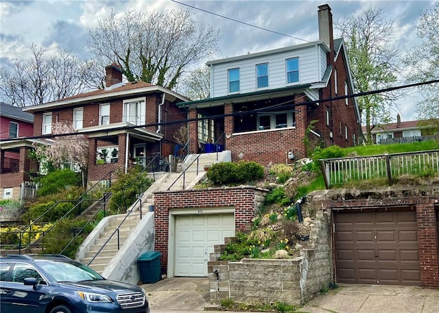 6423 Nicholson St, Squirrel Hill, PA 15217 - view of front of house with stairway, driveway, brick siding, and a chimney