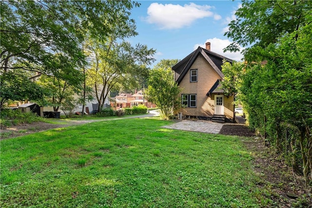 3656 Baytree, Observatory Hill, PA 15214 - rear view of house featuring a chimney, a lawn, a patio, and entry steps