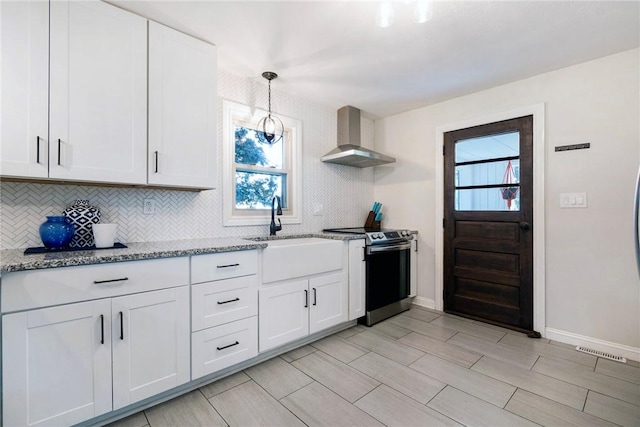 115 Muddy Creek Dr, Center Twp, PA 16001 - kitchen with wall chimney exhaust hood, stainless steel range with electric cooktop, tasteful backsplash, and light stone counters