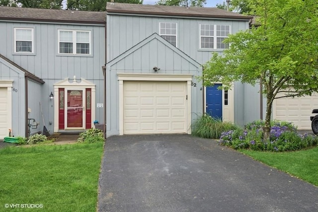 82 Monmouth Dr, Cranberry Twp, PA 16066 - view of property featuring board and batten siding, driveway, a garage, a front yard, and a shingled roof