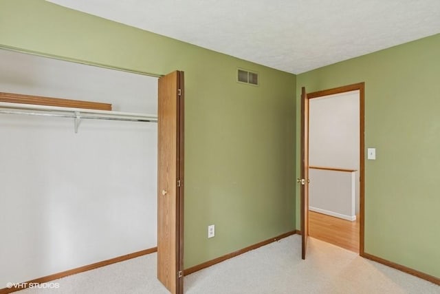 82 Monmouth Dr, Cranberry Twp, PA 16066 - unfurnished bedroom featuring light colored carpet, a closet, and a textured ceiling