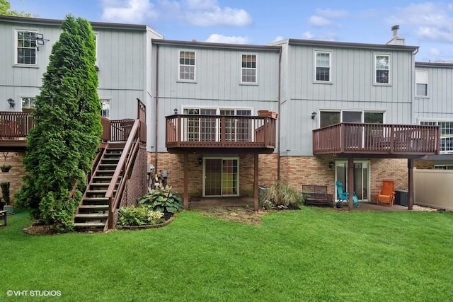 82 Monmouth Dr, Cranberry Twp, PA 16066 - rear view of house with a yard, brick siding, and stairway