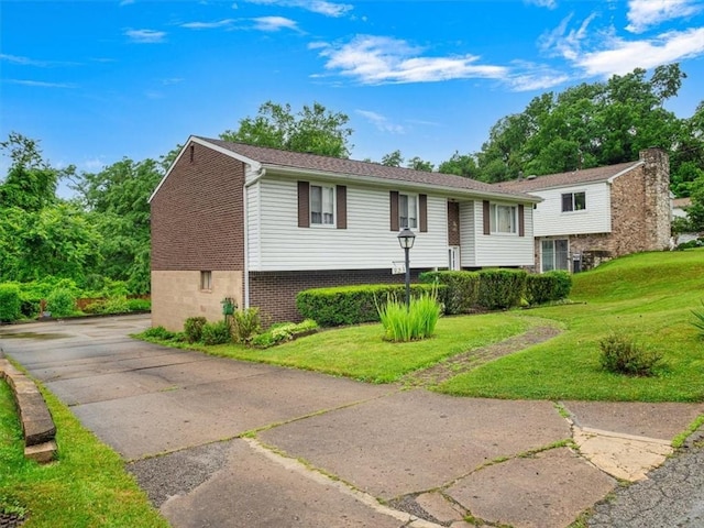 823 Clearview Dr, Penn Hills, PA 15147 - view of front of home featuring a front lawn and brick siding