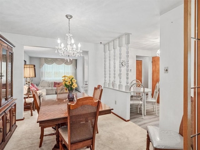 823 Clearview Dr, Penn Hills, PA 15147 - dining space with a chandelier and light colored carpet