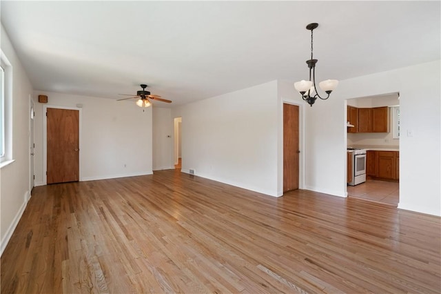 6623 Rosemoor St, Squirrel Hill, PA 15217 - unfurnished living room featuring a chandelier, light wood-style floors, and a ceiling fan