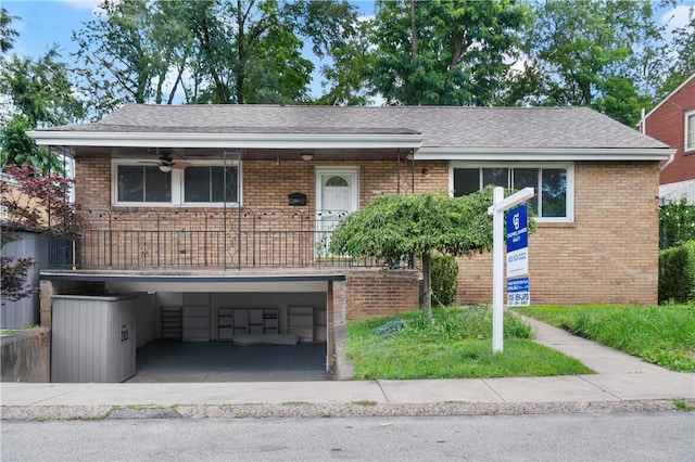 6623 Rosemoor St, Squirrel Hill, PA 15217 - view of front facade with a carport, brick siding, concrete driveway, and a shingled roof