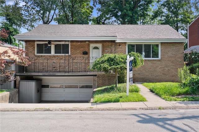 6623 Rosemoor St, Squirrel Hill, PA 15217 - view of front facade with brick siding, a garage, and a shingled roof
