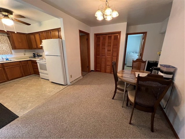 7 S Wabash St, Mount Pleasant Twp, PA 15361 - dining room with washer / clothes dryer, ceiling fan, a chandelier, and light colored carpet