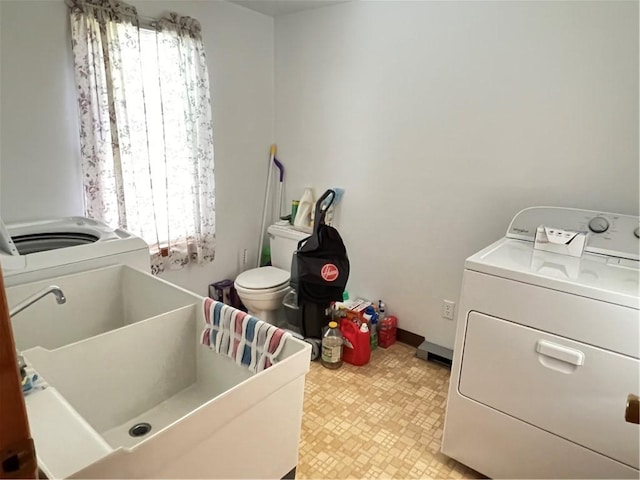 7 S Wabash St, Mount Pleasant Twp, PA 15361 - washroom with light floors and washing machine and dryer