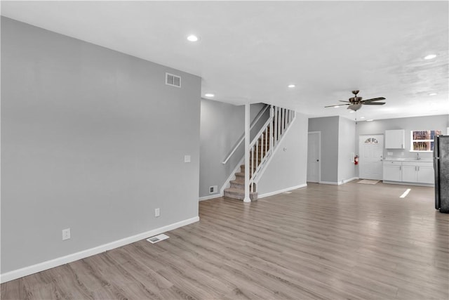 1406 Broadway Ave, Stowe Twp, PA 15136 - unfurnished living room featuring stairs, recessed lighting, light wood-type flooring, and ceiling fan
