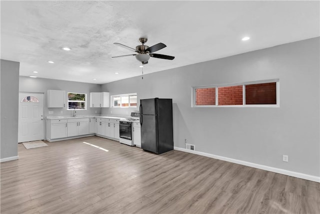 1406 Broadway Ave, Stowe Twp, PA 15136 - kitchen featuring freestanding refrigerator, white gas range, light wood finished floors, a ceiling fan, and light countertops