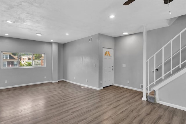 1406 Broadway Ave, Stowe Twp, PA 15136 - unfurnished living room with wood finished floors, a ceiling fan, stairway, and recessed lighting