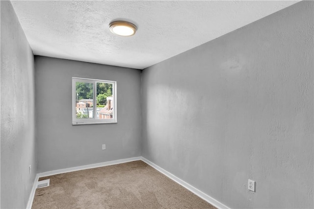 1406 Broadway Ave, Stowe Twp, PA 15136 - unfurnished room with carpet flooring and a textured ceiling