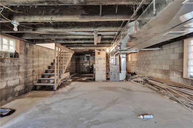 1406 Broadway Ave, Stowe Twp, PA 15136 - basement with heating unit, stairs, and healthy amount of natural light