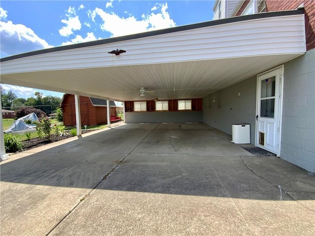 90 Steubenville Pike, Hanover Twp, PA 15021 - view of car parking featuring an attached carport, concrete driveway, and a storage shed